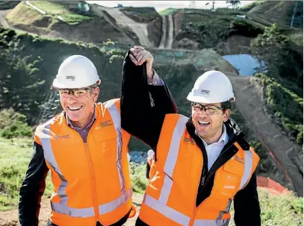  ?? PHOTOS: MAARTEN HOLL/FAIRFAX NZ ?? Otaki MP Nathan Guy, left, and Transport Minister Simon Bridges visit the Transmissi­on Gully site north of Wellington.