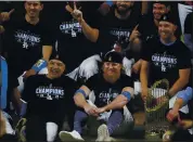  ?? ERIC GAY — THE ASSOCIATED PRESS ?? Dodgers third baseman Justin Turner sits next to manager Dave Roberts after Los Angeles defeated the Tampa Bay Rays in Game 6 on Tuesday night to win the World Series.