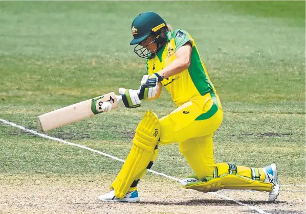  ?? Pictures: Getty Images, AAP ?? Australian wicketkeep­er Alyssa Healy plays a shot against New Zealand and (inset) with husband Mitch Starc.