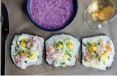  ?? Tribune News Service ?? ■ Cocktail shrimp open-faced sandwiches are served along with chlodnik, chilled beet soup with kefir.