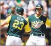  ?? THEARON W. HENDERSON — GETTY IMAGES ?? The A’s Matt Olson, right, and Matt Joyce celebrate after Olson hit a two-run homer in the second.