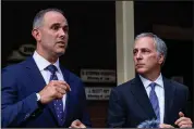  ?? (AP/Ron Harris) ?? Attorney Jason Sheffield (left) and his law firm partner, Robert Rubin, respond Thursday to reporters’ questions outside their office in Decatur, Ga.