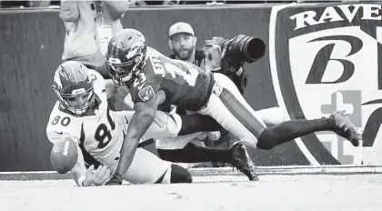  ?? KENNETH K. LAM/BALTIMORE SUN ?? Ravens safety Tony Jefferson, right, prevents Broncos tight end Jake Butt from catching a fourth-down pass during the fourth quarter of the Ravens’ 27-14 win in Week 3. Jefferson will miss Sunday’s game against the Falcons with an ankle injury.