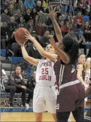  ?? GENE WALSH — DIGITAL FIRST MEDIA ?? Upper Dublin’s Maggie Weglos goes to the hoop as Abington’s Kassondra Brown defends.