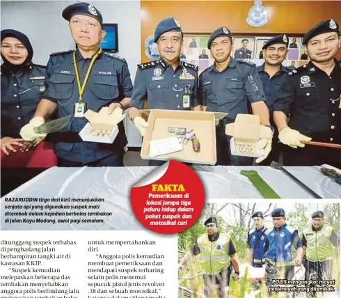  ?? FOTO ?? RAZARUDDIN (tiga dari kiri) menunjukka­n senjata api yang digunakan suspek mati ditembak dalam kejadian berbalas tembakan di Jalan Kayu Madang, awal pagi semalam.
POLIS mengangkat mayat penjenayah yang ditembak.