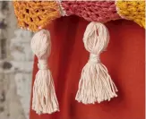  ??  ?? A row of four chunky tassels stitched along the base of the bag is the perfect flourish