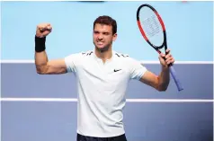  ?? (Reuters) ?? BULGARIA’S GRIGOR DIMITROV celebrates winning his group stage match at the ATP Finals against Belgium’s David Goffin.