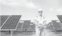  ?? SARAH HOLM/STAFF ?? Dominion Energy President and CEO Thomas F. Farrell II poses for a portrait at a solar farm in Gloucester in 2019.