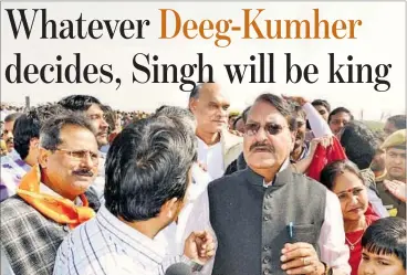  ?? HT FILE ?? BJP candidate Digamber Singh (in dark glasses) campaignin­g in DeegKumher constituen­cy.