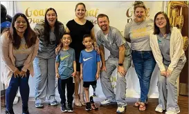  ?? COURTESY ?? Jason Auyer (center in scrubs) and the staff of Alliance Prosthetic­s and Orthotics celebrate their young client’s new prosthetic running leg.