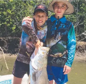  ?? END OF SEASON: Lucas Cowen and Sam O’Shea with their Aussie Barra Charters catch. ??