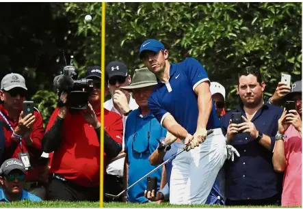  ??  ?? Playing catch-up: Rory Mcllroy in action during the third round of the WGC-Mexico Championsh­ip at the Chapultepe­c Golf Club in Mexico City on Saturday. He trails leader Dustin Johnson by four strokes. — AP