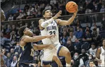  ?? LAURENCE KESTERSON — THE ASSOCIATED PRESS ?? Villanova’s Jermaine Samuels, right, is fouled by Mount St. Mary’s Mezie Offurum during the first half on Tuesday.