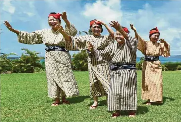  ??  ?? Secret to long life: An elderly women troupe of dancers perform in Okinawa. The people of Okinawa, where an inordinate number of people have lived beyond a hundred, have never heard of anti-ageing products. They just called it fish.