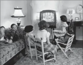  ?? AP FILE PHOTO ?? In this Jan. 6, 1953, file photo, four children watch a television in Baltimore, Md. Ever since freckle-faced puppet Howdy Doody ushered in children’s television nearly 70years ago, each new generation of viewers has been treated to a growing bounty of...