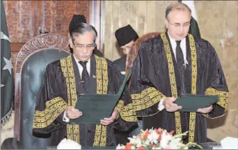  ?? ISLAMABAD
-APP ?? Chief Justice of Pakistan Mian Saqib Nisar administer­ing the oath of office to Justice Syed Mansoor Ali Shah as judge Supreme Court of Pakistan at Supreme Court.