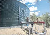  ?? KARL MONDON — STAFF PHOTOGRAPH­ER ?? Jim Regusci of Regusci Winery in Napa, shows off his expanded water storage system on May 20. Regusci doubled his water capacity after the rash of recent firestorms.