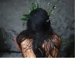  ?? PICTURE: REUTERS ?? TRADITION: A woman lashes herself with leaves during the Rishi Panchami festival, in Kathmandu, when women worship Sapta Rishi to ask for forgivenes­s for sins committed during their periods.