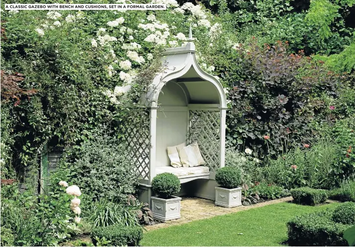 ??  ?? A CLASSIC GAZEBO WITH BENCH AND CUSHIONS, SET IN A FORMAL GARDEN.