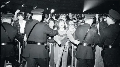  ?? KEN OAKES FILES ?? Fans in 1965 watch the Rolling Stones, rock stars who are said to have been involved in incredible tales of debauchery.