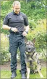  ?? ZANE WOODFORD/METRO ?? Const. Phil MacDonald stands with his police dog, Const. Steeler at Grand Parade Sunday before a matinee performanc­e of the Royal Nova Scotia Internatio­nal Tattoo.