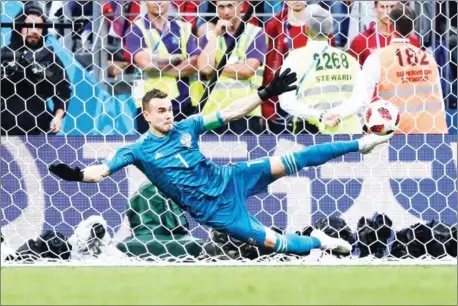  ?? AFP ?? Russia goalkeeper Igor Akinfeev saves a penalty from Spain forward Iago Aspas during a penalty shootout to win their last-16 match at the Russia 2018 World Cup at the Luzhniki Stadium in Moscow on Sunday.