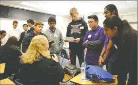  ?? BEA AHBECK/NEWS-SENTINEL ?? Tokay High team members Owen Canestrino, 15, Shreyas Patel, 15, Jack Gobel, 16, Matt Hashimoto, 16, Jasmin Gill, 15, and Rubie Dhillon, 15, listen to Susan Heberle between rounds of the Central Valley Regional Science Bowl at Tokay High School in Lodi...