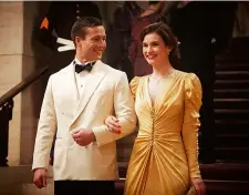  ??  ?? couPling uP Powell with on-screen fiancée Lily James in The Guernsey Literary And Potato Peel Pie Society (below); matchmakin­g with Zoey Deutch inSet It Up (above).