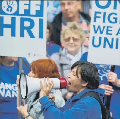  ??  ?? NHS campaigner­s made their voices heard outside Huddersfie­ld Town Hall yesterday.