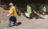  ?? David Owens, Town of Vernon / Contribute­d photo ?? A crew from Opportunit­y Works Connecticu­t picks up nips bottles and other trash Wednesday in Vernon. The effort is funded in part, through surcharge money from the sale of nip bottles.