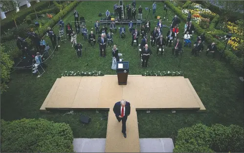  ?? (AP/Alex Brandon) ?? President Donald Trump departs after speaking April 14 about the coronaviru­s in the Rose Garden of the White House in Washington. According to a new survey from The Associated Press-NORC Center for Public Affairs Research, 28% of Americans say they’re getting informatio­n from Trump about the coronaviru­s and 23% say they have high levels of trust in what the president is telling the public.