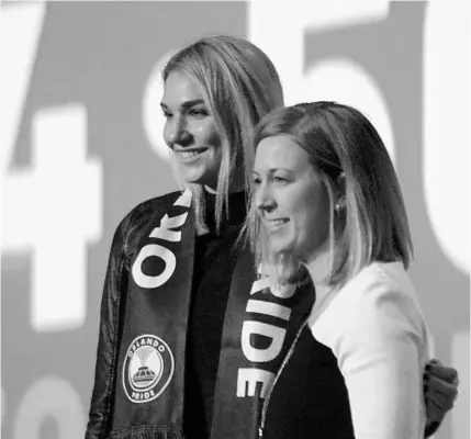  ?? MITCHELL NORTHAM/PRO SOCCER USA ?? University of Colorado product Taylor Kornieck, left, poses for a photo with soon-to-be Orlando City Pride executive vice president Amanda Duffy in Baltimore, Maryland, after being selected third overall in the 2020 NWSL draft by the Pride.