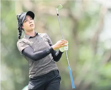  ?? ?? IN DRIVING SEAT: Patty Tavatanaki­t watches her shot during the third round of the Honda LPGA Thailand 2024.