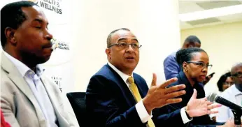  ?? RICARDO MAKYN ?? Health Minister Dr Christophe­r Tufton (centre) speaks at yesterday’s press conference at the University Hospital of the West Indies, addressing rumours of a suspected coronaviru­s case at the institutio­n. Looking on are Dr Carl Bruce (left), medical chief of staff at the UHWI, and Dr Karen Webster-Kerr, acting chief medical officer.