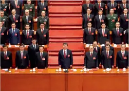  ?? — AP ?? Chinese President Xi Jinping (front row, center) stands with his cadres during the closing ceremony at the Great Hall of the People in Beijing on Tuesday.