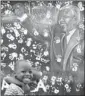  ??  ?? Two young boys walk past a mural depicting former president Nelson Mandela.