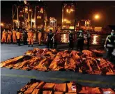  ??  ?? Officials in Jakarta supervise the body bags of passengers recovered from the Lion Air flight