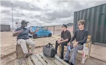  ?? Post by Christophe­r Elliott — Photo for The Washington ?? Iden Elliott, left, and Aren Elliott are briefed before a tour in Khayelitsh­a, South Africa.