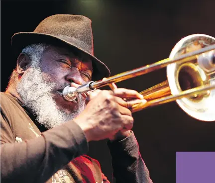  ?? PHOTOS: JULIE OLIVER / OTTAWA CITIZEN ?? Nambo Robinson, from Sly & Robbie, projected his personalit­y not only on the trombone but was also a dynamic vocalist during the legendary reggae act’s River Stage set Friday night at LeBreton Flats.