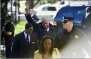  ?? COREY PERRINE — THE ASSOCIATED PRESS ?? Bill Cosby, center, reacts after spokespers­on Andrew Wyatt, left, addresses the media for Cosby’s sexual assault trial Thursday at the Montgomery County Courthouse in Norristown.