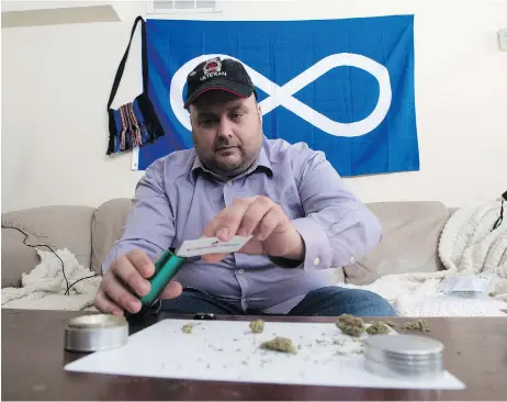  ?? /ADRIAN WYLD / THE CANADIAN PRESS ?? Clayton Goodwin, a veteran, prepares medicinal marijuana at his apartment in Ottawa. The program under which veterans could access marijuana for medical purposes is expected to be dramatical­ly reduced, as the projected costs are expected to reach $90...