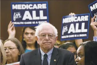  ?? Olivier Douliery / Abaca Press ?? Democratic presidenti­al candidate Sen. Bernie Sanders has introduced Medicare for All legislatio­n and defends the plan against a report that says it could disrupt the health system.