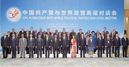  ??  ?? The CPC in Dialogue with World Political Parties High-Level Meeting was held in Beijing from November 30th to December 3rd, 2017 in Beijing. The picture shows the CPC General Secretary and Chinese President Xi Jinping posing for a photo with foreign guests. (Photo source: Xinhua News Agency)