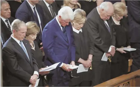  ??  ?? IN HIS HONOR: Above left, from left, former President George W. Bush, former first lady Laura Bush, former President Bill Clinton, former Secretary of State Hillary Clinton, former Vice President Dick Cheney and his wife, Lynne, bow their heads in prayer at a memorial service for Sen. John McCain (R-Ariz.), at Washington National Cathedral yesterday. McCain’s widow, Cindy, follows his casket, top left, and lays a wreath at the Vietnam Veterans Memorial, above right.