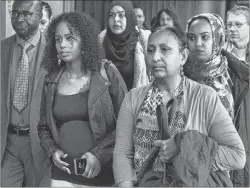  ?? CP PHOTO ?? Fatouma Abdi, second from left, Abdoul Abdi’s sister, heads from Federal Court with supporters after a hearing to determine whether deportatio­n proceeding­s should be halted for the former child refugee, in Halifax on Thursday. The federal government...