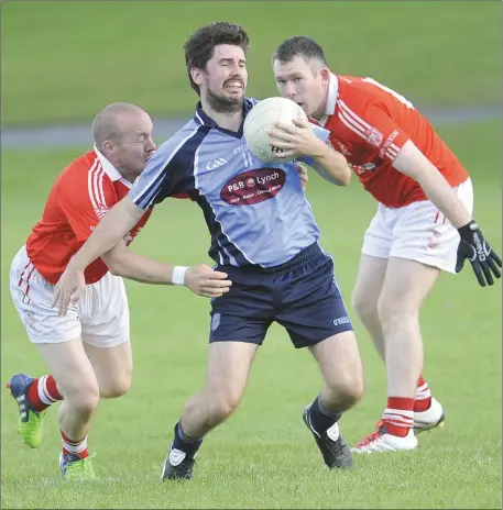  ??  ?? Darren Thornton watches his St. Nicholas teammate Alan Gregory tackle Conor Sheridan of Glyde Rangers during the Group B JFC match in Louth Village.