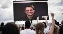  ?? (Mathias Loevgreen Bojese/Reuters) ?? AMERICAN WHISTLEBLO­WER Edward Snowden is seen on a screen as he delivers a speech during the Roskilde Festival in Denmark.