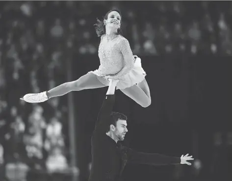  ?? SEAN KILPATRICK/THE CANADIAN PRESS ?? Canadians Meagan Duhamel and Eric Radford begin their farewell tour at Skate Canada Internatio­nal in Regina.