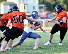  ?? PILOT PHOTO/RON HARAMIA ?? Culver’s Ben Lee (50) and Hunter Evans (far right) converge on Triton’s Anthony Schuh during a game earlier this season. Sectionals begin this Friday.