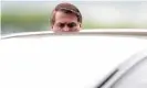  ??  ?? President Jair Bolsonaro speaks with supporters while he leaves Alvorada Palace in Brasília on Tuesday. Photograph: Ueslei Marcelino/Reuters